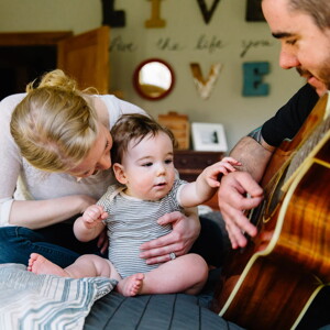Baby listening to daddy play guitar Baby listening to daddy play guitar