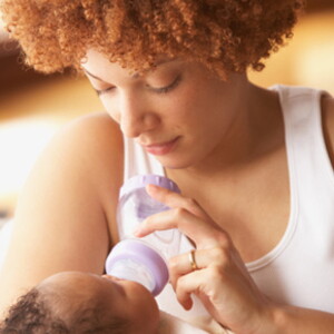 Mom feeding baby Mom feeding baby